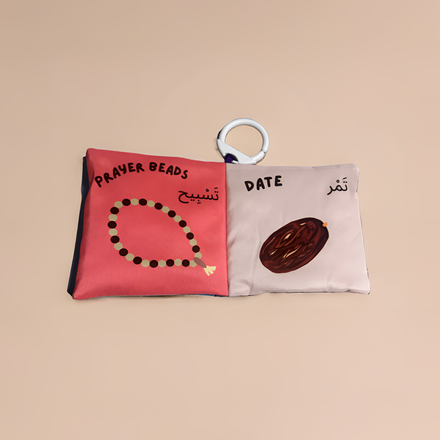 Fabric book with illustrations of prayer beads and a date, on a beige background.
